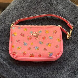 Coach Vibrant Pink Wristlet with Floral Accents